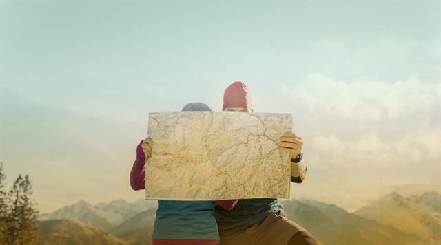Hiker couple looking at a map